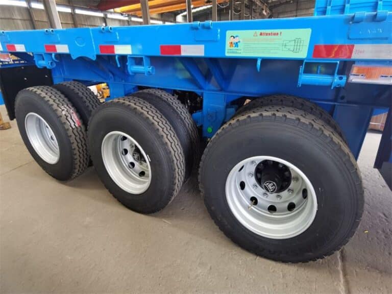 etailed close-up of the 12.00R20 tire on the Side Wall Trailer